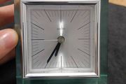 This is an Acctim Hamilton mantel clock made of glass and metal.