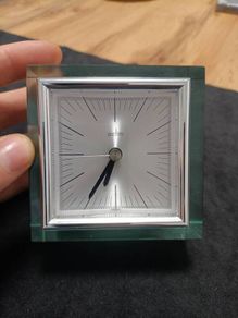 This is an Acctim Hamilton mantel clock made of glass and metal.