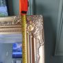 Gold affect mirror. Looks antique. Image 3