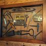 vintage shadow box containing a mix of antique tools, keys, and a loom. Image 5