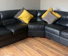 Large black leather sofa