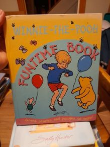 Winnie the Pooh hardback book with stories and puzzles