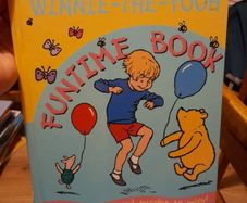 Winnie the Pooh hardback book with stories and puzzles