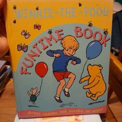 Winnie the Pooh hardback book with stories and puzzles