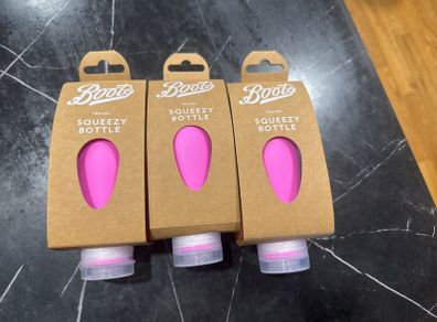 Set of 3 brand new squeezy travel bottles