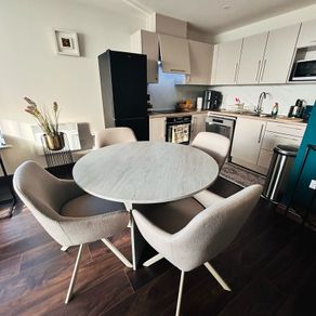 Dining table and 4 chairs .
