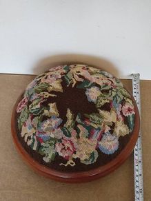 Vintage hand embroidered floral design on wooden base stool,