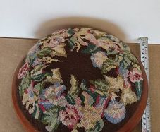 Vintage hand embroidered floral design on wooden base stool,