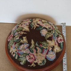 Vintage hand embroidered floral design on wooden base stool,