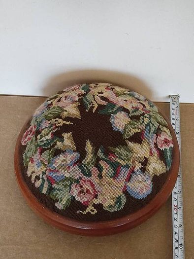 Vintage hand embroidered floral design on wooden base stool,