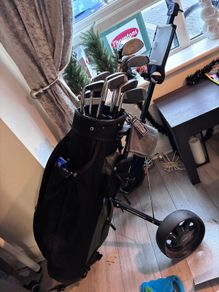 golf caddy and clubs