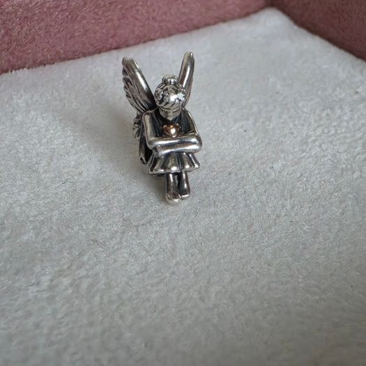 Pandora sitting pixie charm with 14k yellow gold heart  very good condition hallmarked