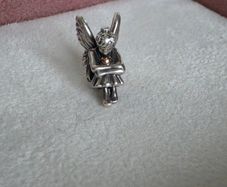 Pandora sitting pixie charm with 14k yellow gold heart  very good condition hallmarked
