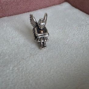 Pandora sitting pixie charm with 14k yellow gold heart  very good condition hallmarked