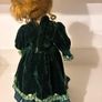 Vintage porcelain doll in green velvet dress Image 3