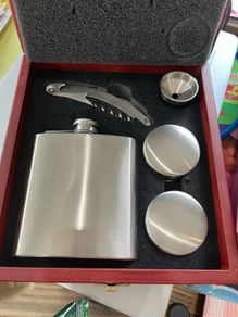Drinks flask cups and cork screw