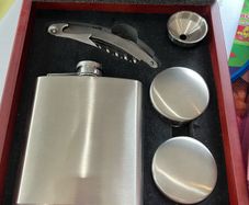 Drinks flask cups and cork screw