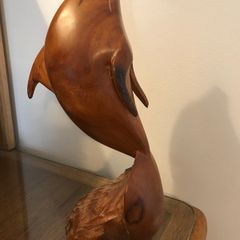 Vintage hand-carved wooden leaping dolphin