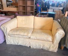 Butter yellow two seater sofa