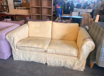 Butter yellow two seater sofa
