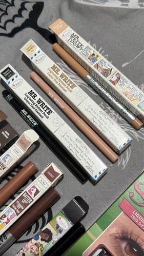 The balm tinted brow gel, clear brow gel, white, black eye pencils, liquid eyeliners