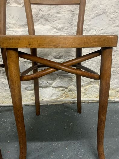 A pair of tall Thonet bentwood chairs.