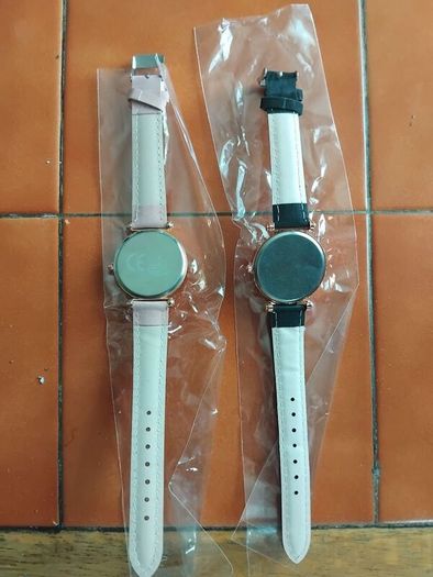 2 womens watches with leather straps