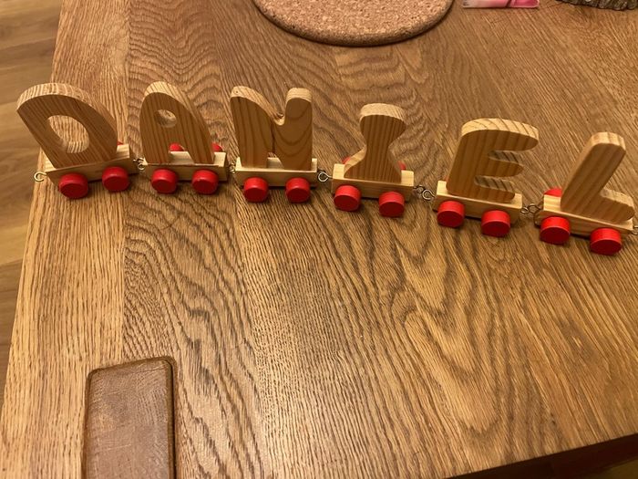 Assortment of wooden letters on wheels