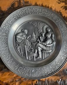 Vintage pewter wall hanging plates