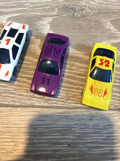 Four plastic Toy Cars