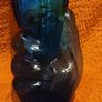 very unusual blue vase held in a hand Image 2