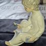 Porcelain Boy with Candle Nao by Lladro, depicting a seated child in a white nightshirt holding a small candle, postage available or collection Image 2