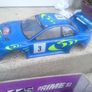 R/C Subaru car for parts + 2 controls Image 5