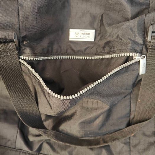 Large black expandable travel bag with shoulder strap