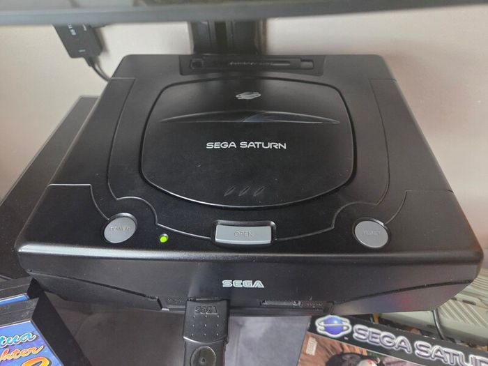 Sega Saturn w/ 3D Control Pad, Arcade Racer, Lightgun and Games