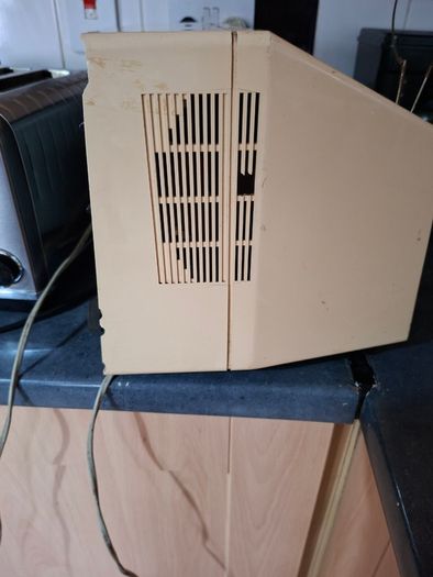 Ideal Prop, Vintage Working Boots Audio TV12 Portable Black and White CRT Television, featuring a cream plastic casing with side control dials and a 12 inch screen. Designed with dual power capabilities supporting standard mains voltage (240V) as well as 