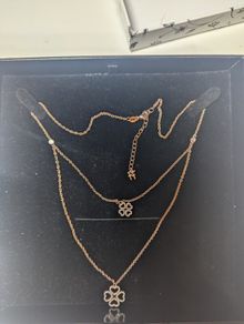 silver pendant with two shamrocks and two lil stones