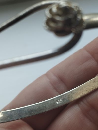 Vintage sterling silver bracelet with a rose-shaped clasp.