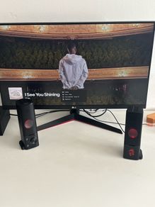 monitor, speakers and gaming chair set