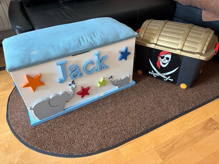 x2 Toy storage boxes Personalized white toy box features a light blue cushioned seat, the name "Jack" and pirate plastic box with lead