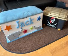 x2 Toy storage boxes Personalized white toy box features a light blue cushioned seat, the name "Jack" and pirate plastic box with lead