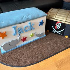 x2 Toy storage boxes Personalized white toy box features a light blue cushioned seat, the name "Jack" and pirate plastic box with lead