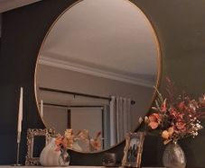 Round gold mirror