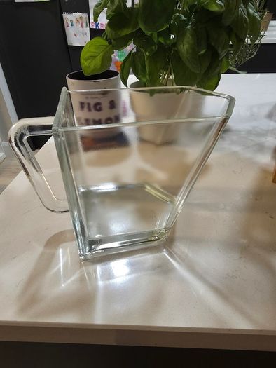 Wooden display shelf with glass jugs