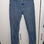Distressed blue jeans Image 2