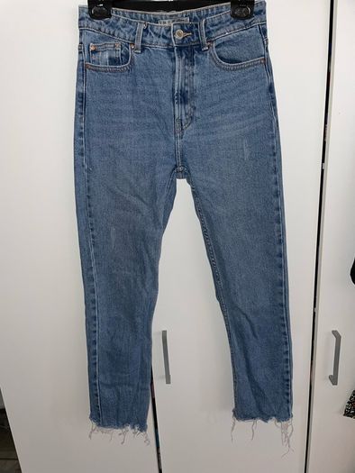Distressed blue jeans