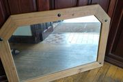 Large pine mirror decorated with black studs