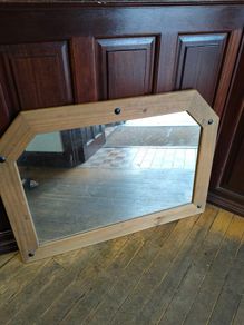 Large pine mirror decorated with black studs