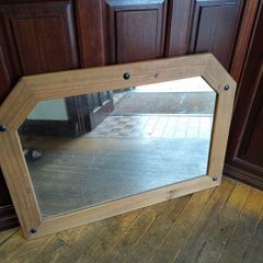 Large pine mirror decorated with black studs