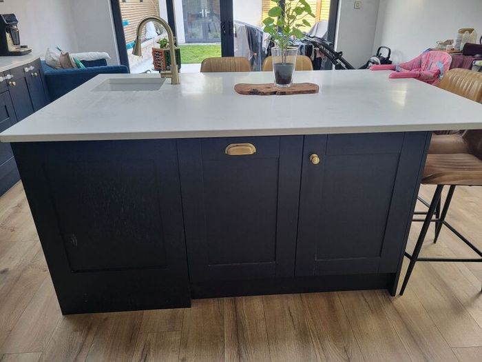 Kitchen units, island and quartz worktops.